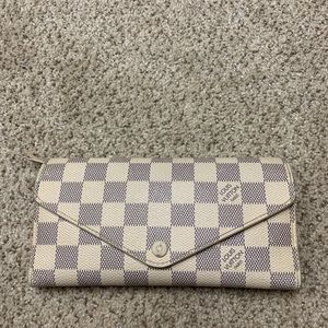 Louis Vuitton wallet.